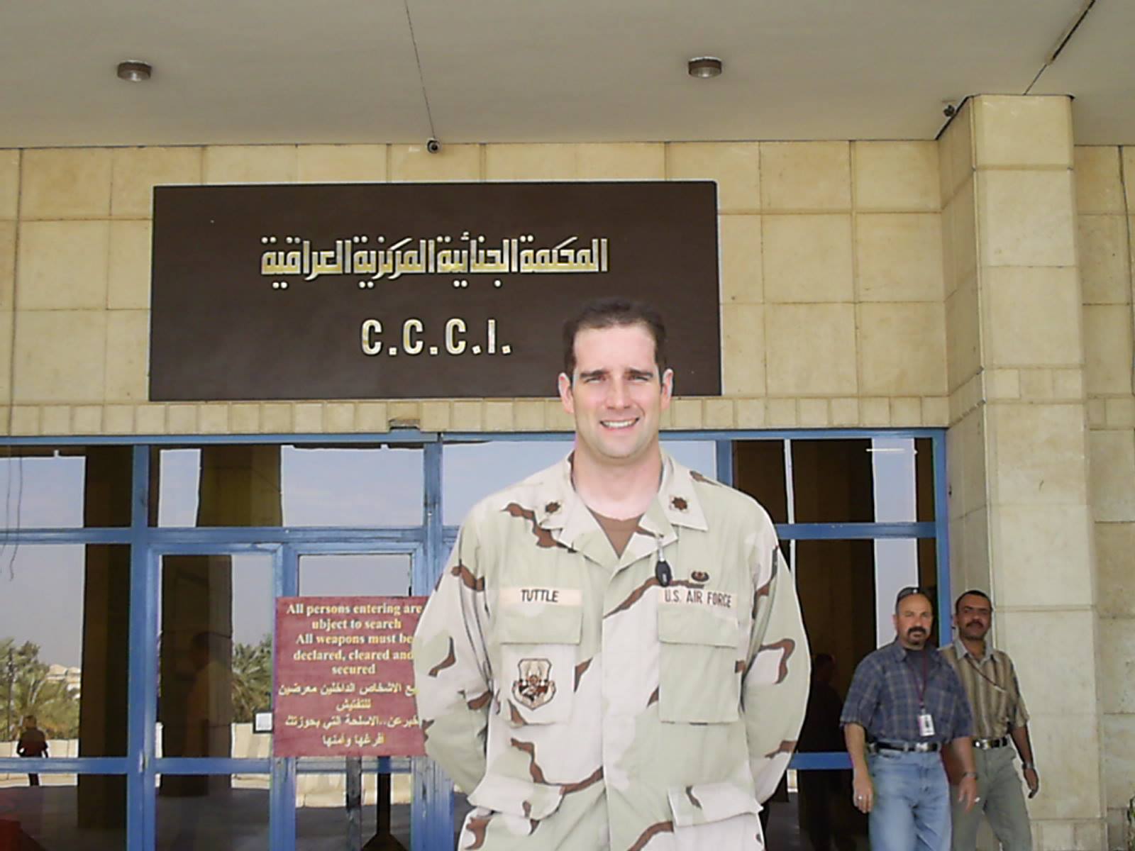 Tim Tuttle standing in uniform in front of a building